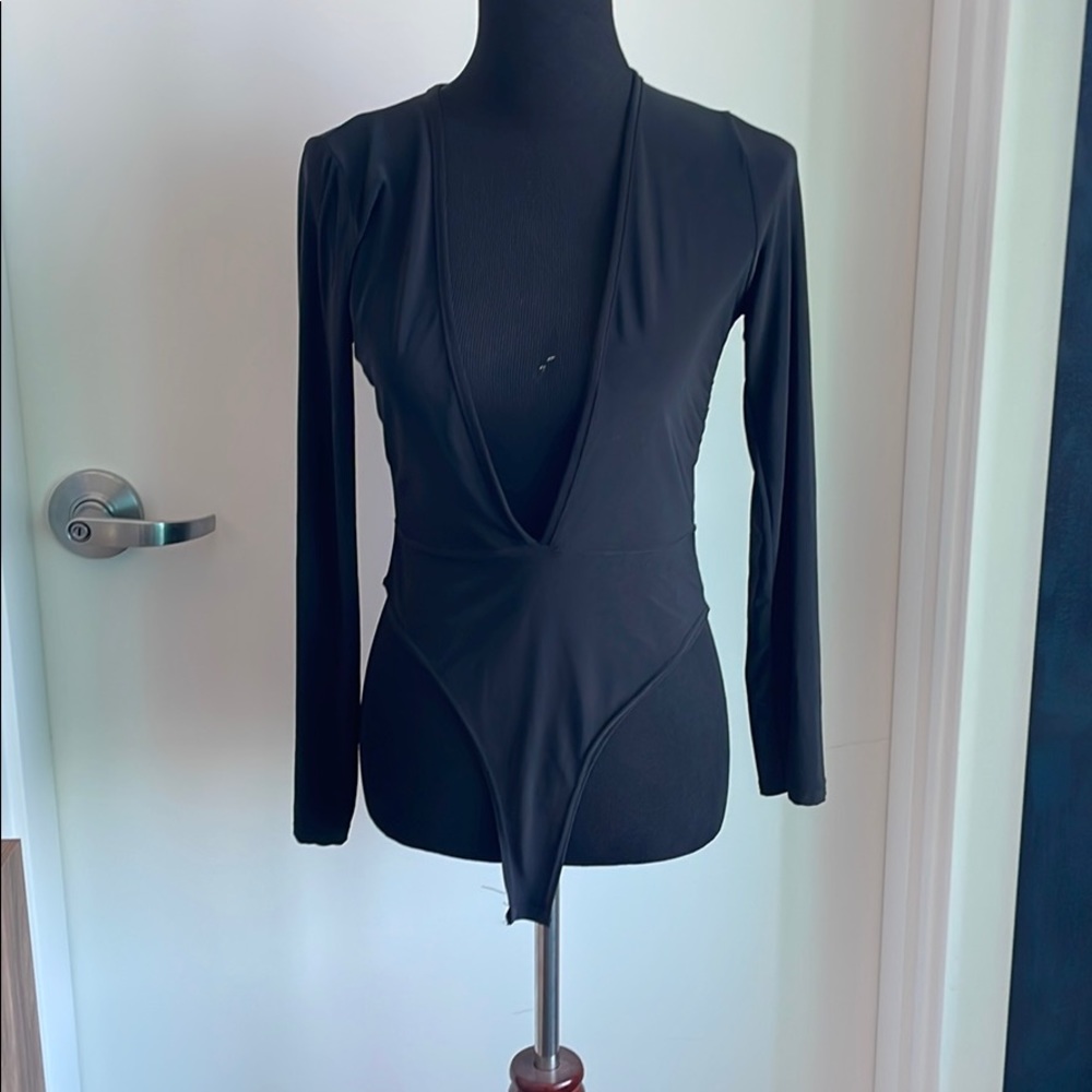 Low cut black bodysuit never worn! Nasty gal brand